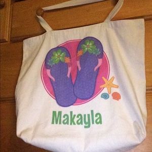 White bag with the name Makayla